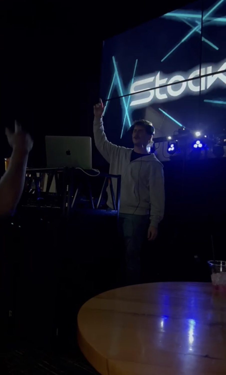 Stoakley with a hand in the air mid-set